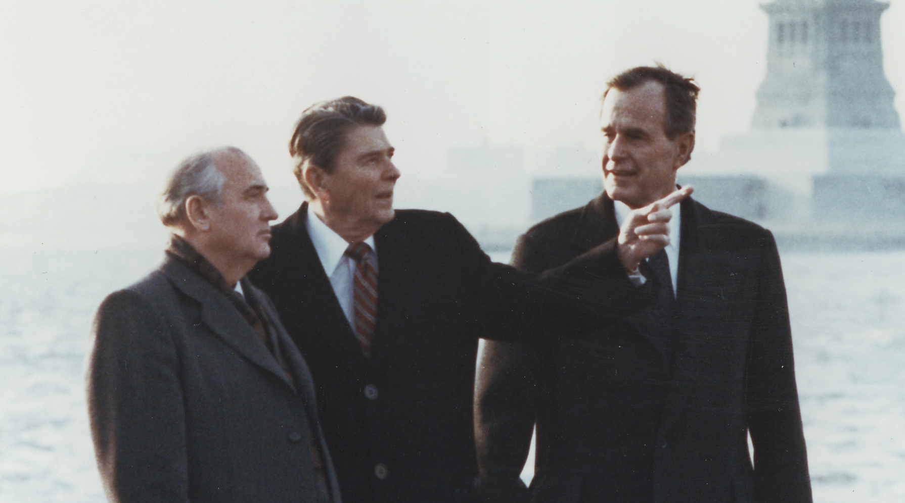 Mikhail Gorbachev with President Ronald Reagan and then Vice-president George H.W. Bush on Governors Island in New York.