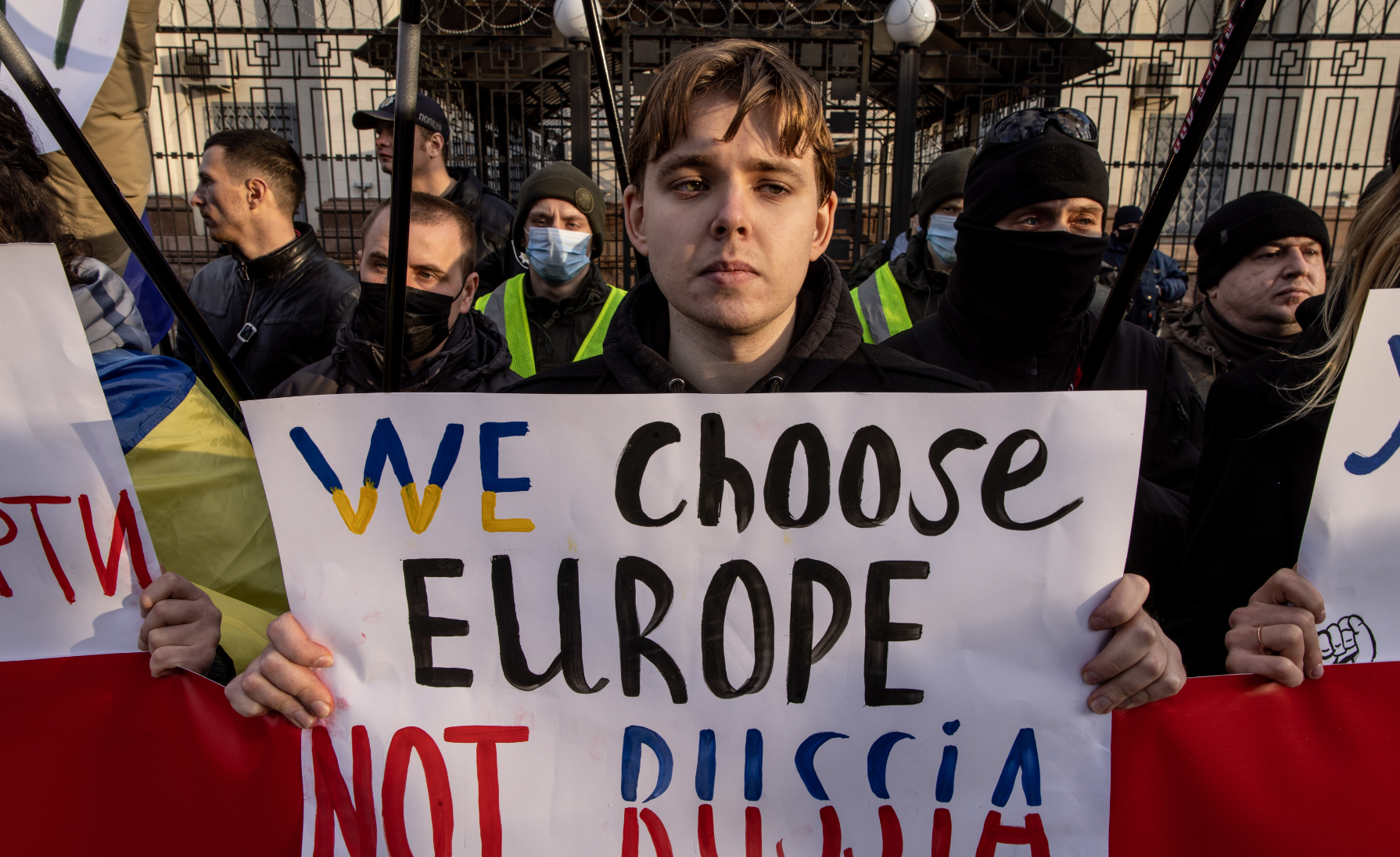 Protesters in Kyiv display anti-Russia, pro-democracy signs.