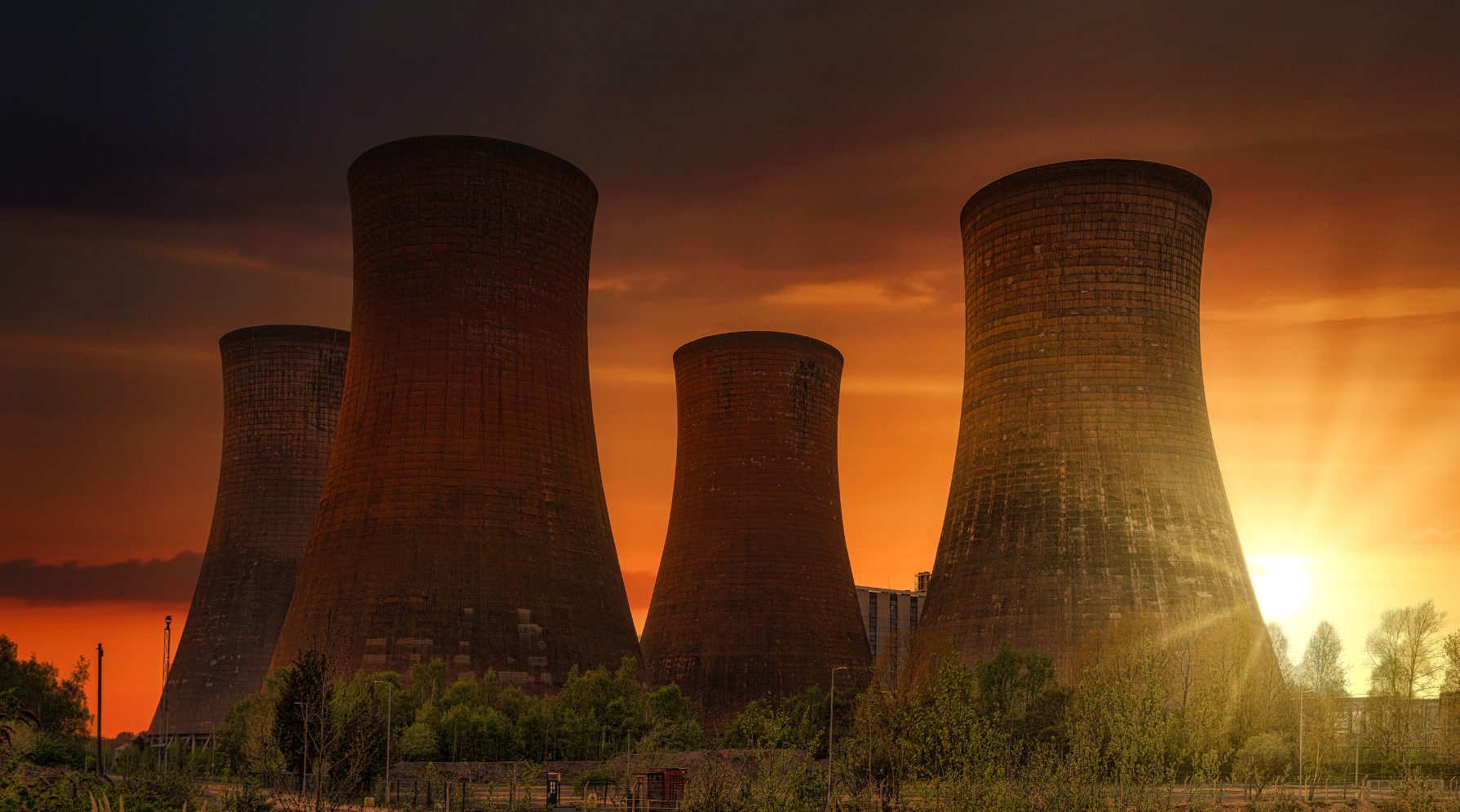 Towers of a nuclear reactor at sunset 